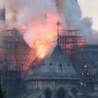 epa07508685 Flames on the roof of the Notre-Dame Cathedral in Paris, France, 15 April 2019. A fire started in the late afternoon in one of the most visited monuments of the French capital.  EPA/IAN LANGSDON